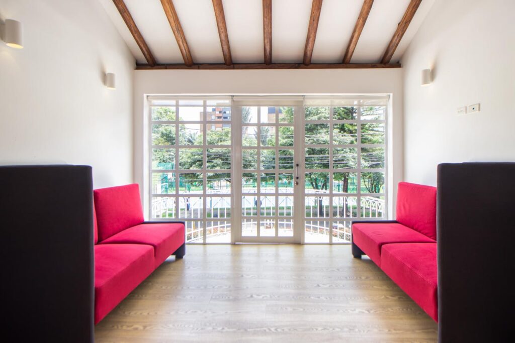 Red Sofa in the Living Room with Wooden Flooring